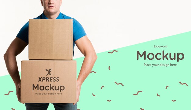 Download Free PSD | Delivery man holding a bunch of boxes mock-up
