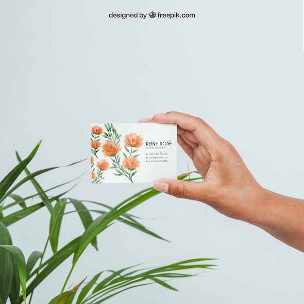 Free PSD design of mock up with hand holding business card