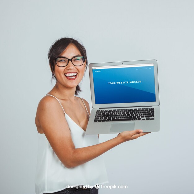 Design of mock up with happy young woman and laptop's screen