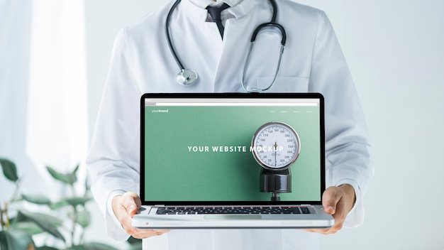 Doctor holding laptop mockup for website