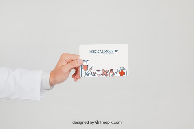 Doctor's hand with mock up of card