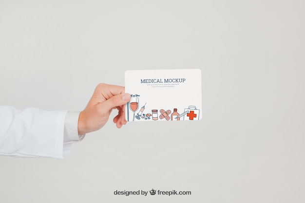 Doctor's hand with mock up of card