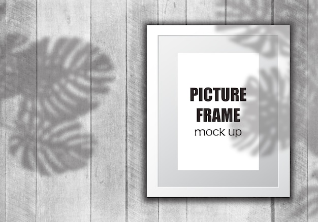 Free PSD editable picture frame mock up with plant shadow overlay