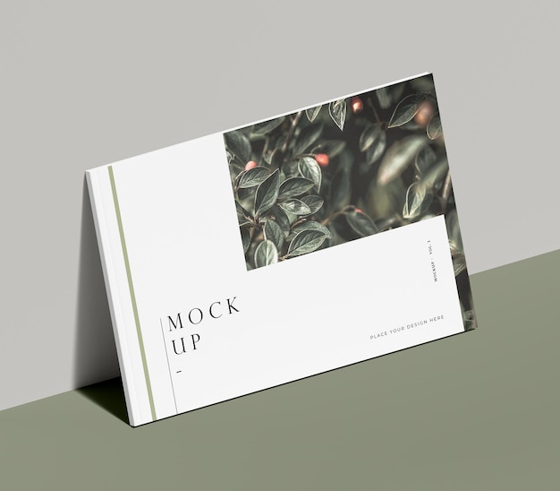 Editorial magazine mock-up with nature leaning on a wall