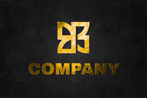 Free PSD emboss logo mockup psd in gold for company with tag line here text