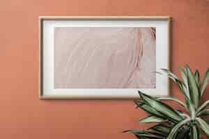 Free PSD empty frame on a wall