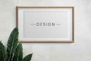 Free PSD empty frame on a wall