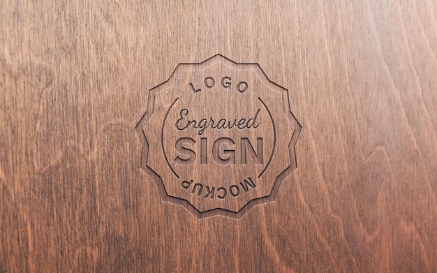 Engraved logo on wooden surface mockup