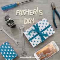 Free PSD father's day lettering, gift boxes, smartphone, watch and tools