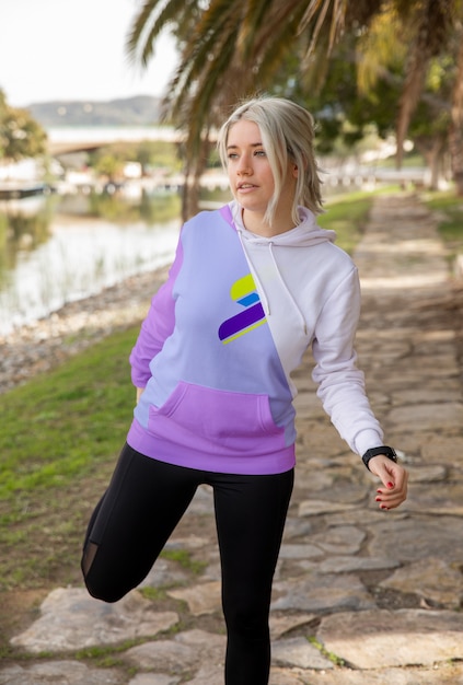 Female wearing hoodie exercising