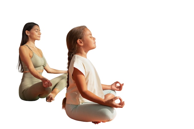 Free PSD female yoga instructor doing meditation with young girl