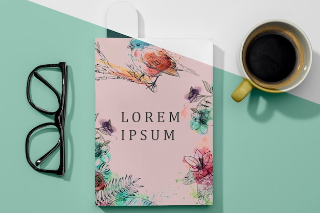 Flat lay book mock-up with glasses and coffee