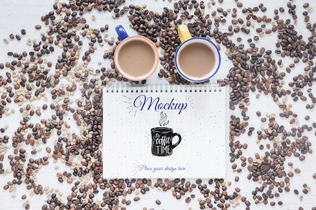 Flat lay mugs filled with coffee and coffee beans