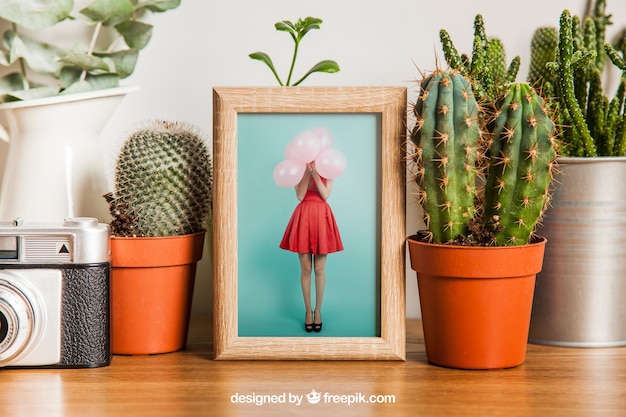 Free PSD frame mockup with cactus decoration