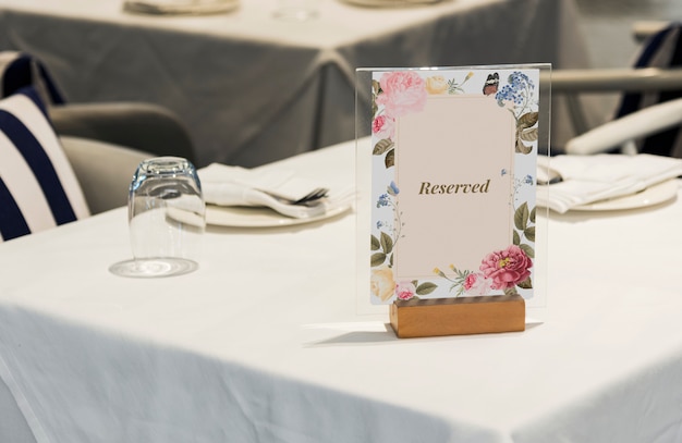 Framed reserved sign on the table