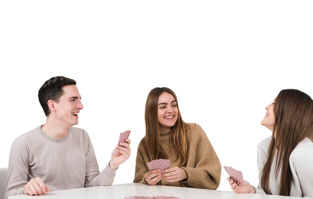 Friends playing card games isolated