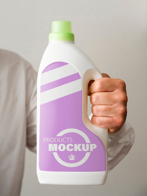 Front view man holding a cleaning bottle Free Psd