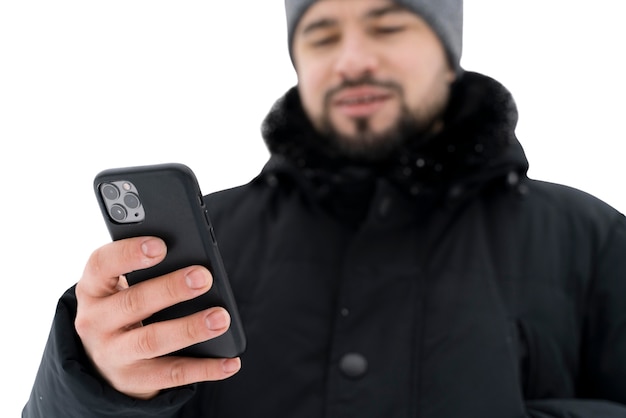 Free PSD front view man holding smartphone