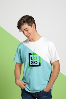 Front view of man posing while wearing t-shirt