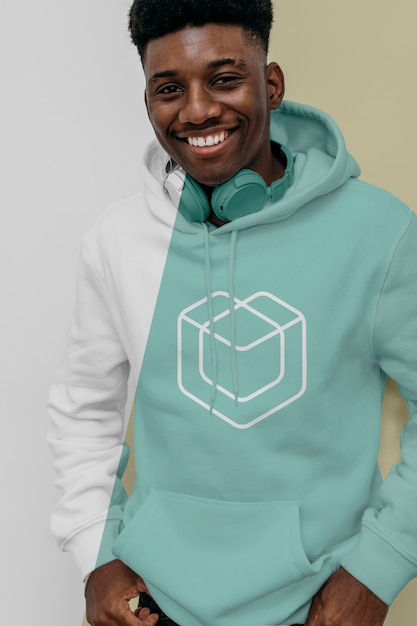 Front view of smiley man in hoodie with headphones