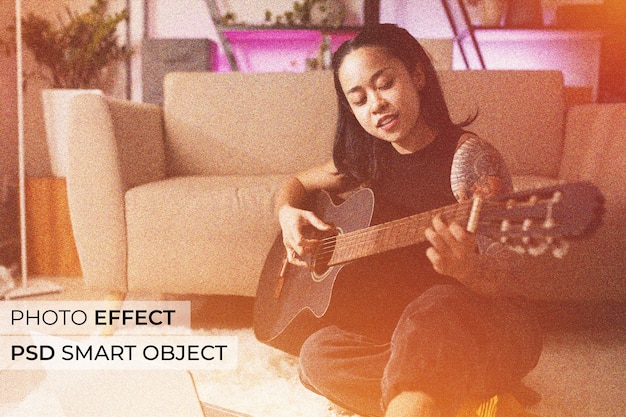 Full shot smiley woman playing the guitar