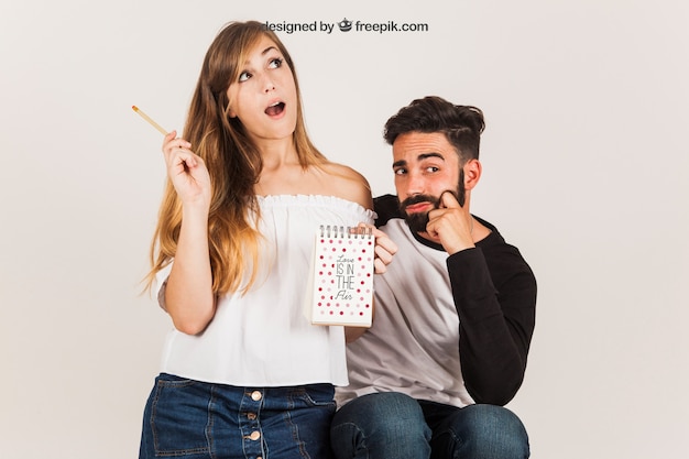 Funny couple with notepad