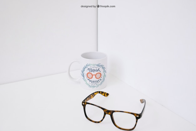 Free PSD glasses in front of coffee mug