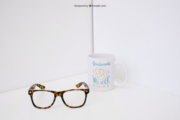 Glasses in front of mug