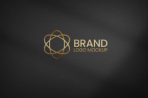 Golden logo on black textured paper mockup