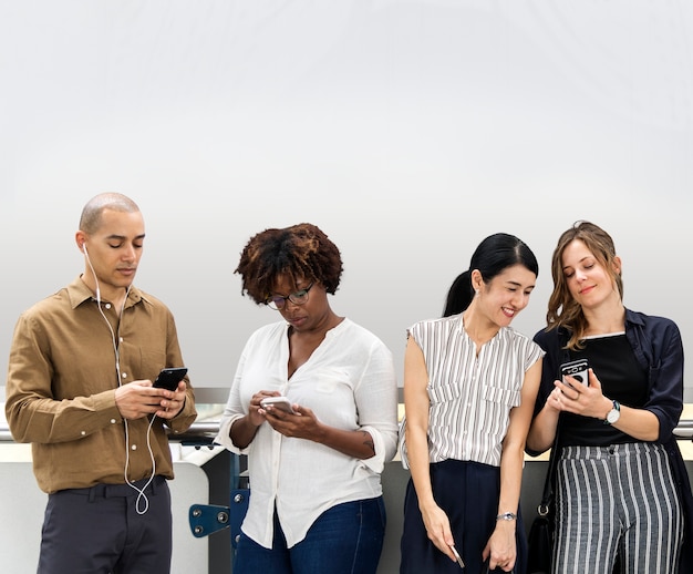 Free PSD group of diverse people using smartphones