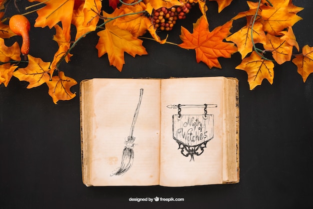 PSD gratuito mockup di halloween con foglie di autunno e libro