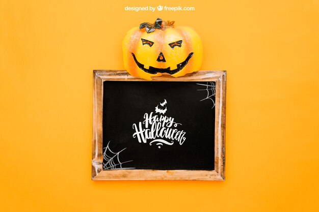 Halloween mockup with pumpkin op top of slate