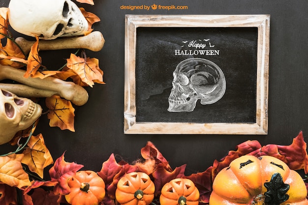 Free PSD halloween slate mockup with autumn leaves and skull