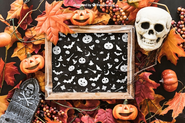Halloween slate mockup with skull and tombstone on leaves