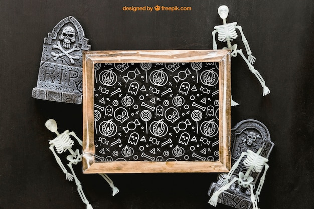 Mockup di ardesia di halloween con lapidi e scheletri