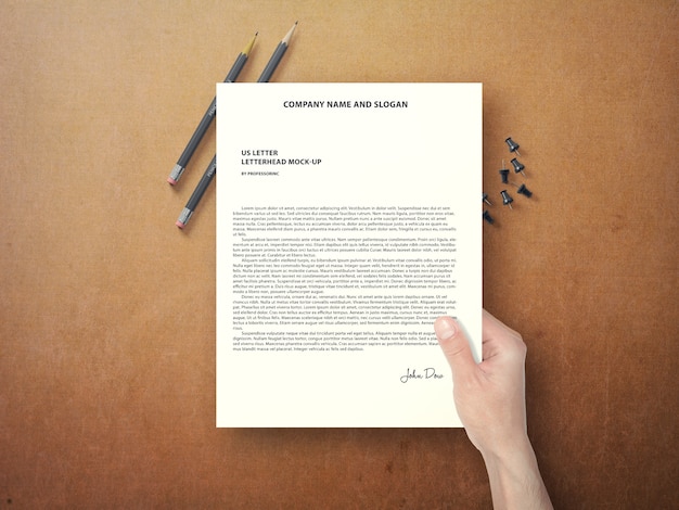 Hand holding document mock up