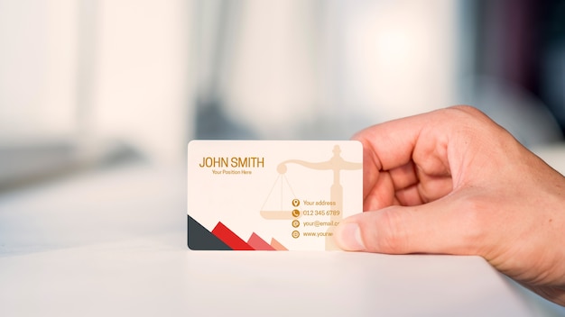 Hand presenting business card mockup