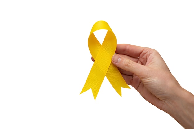 Hand with yellow ribbon