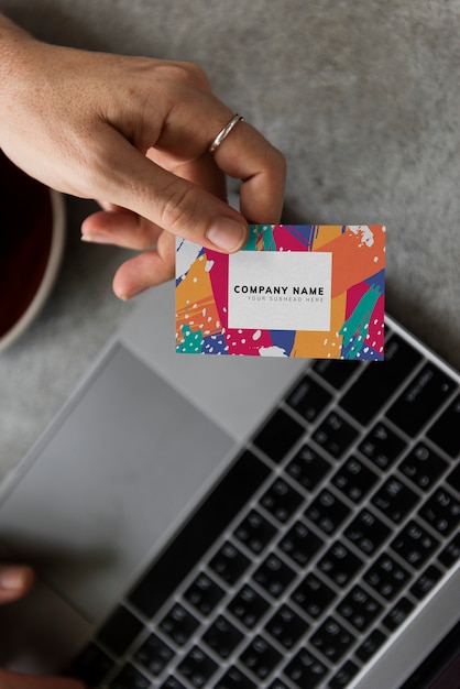 Handing out a business card mockup – Free PSD Templates for Download