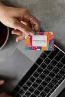 Free PSD handing out a business card mockup