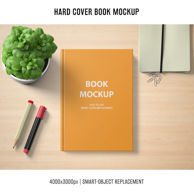 Mockup di libro con copertina rigida con basilico