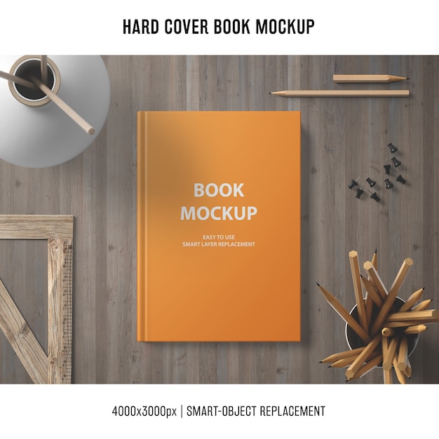 Free PSD hard cover book mockup with wooden elements