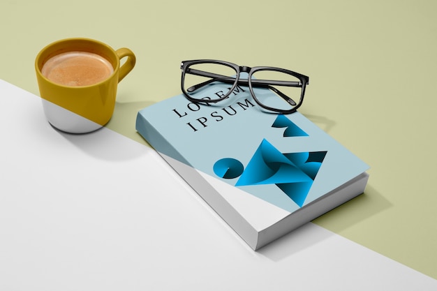 High angle book mock-up with glasses and coffee