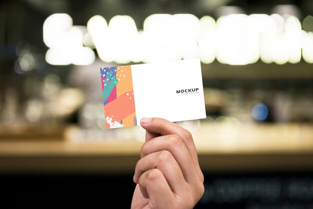 Holding up a business card mockup