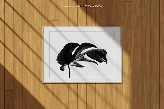 창 그림자가 있는 벽에 걸려 있는 수평 나무 포스터 또는 사진 프레임 모형. 3d 렌더링.