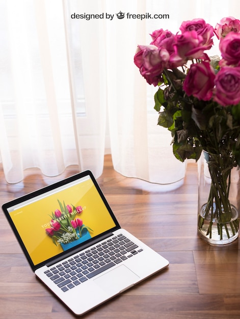 Laptop mockup with flowers