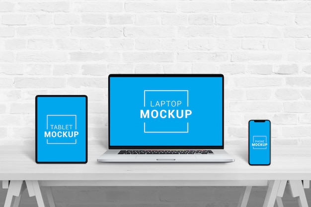 Laptop, tablet and phone mockup in office