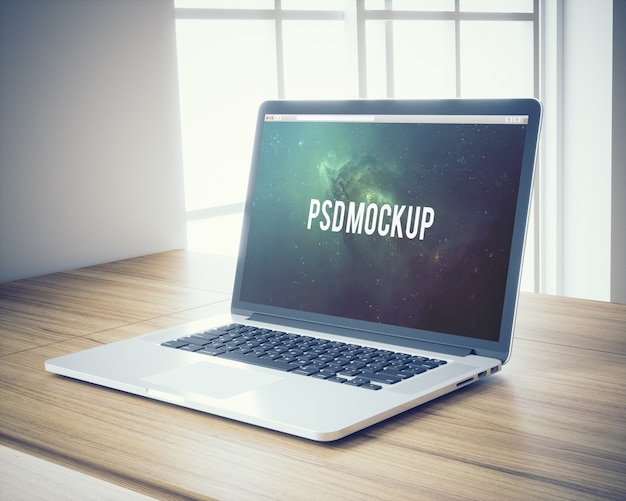 Free PSD laptop on wooden desk background mock up