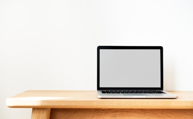 Laptop on a wooden table