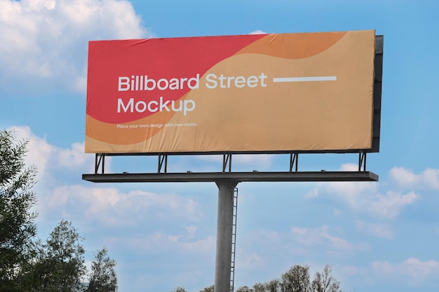 Large billboard mockup on blue sky with clouds Free Psd